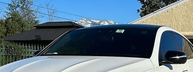 White Mercedes-Benz GLE AMG after a detail, mountains behind it